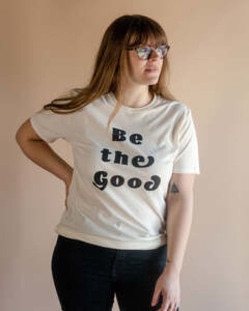 Front of a model wearing a size Large Be The Good Graphic T-Shirt in Natural by Polished Prints. | dia_product_style_image_id:239705